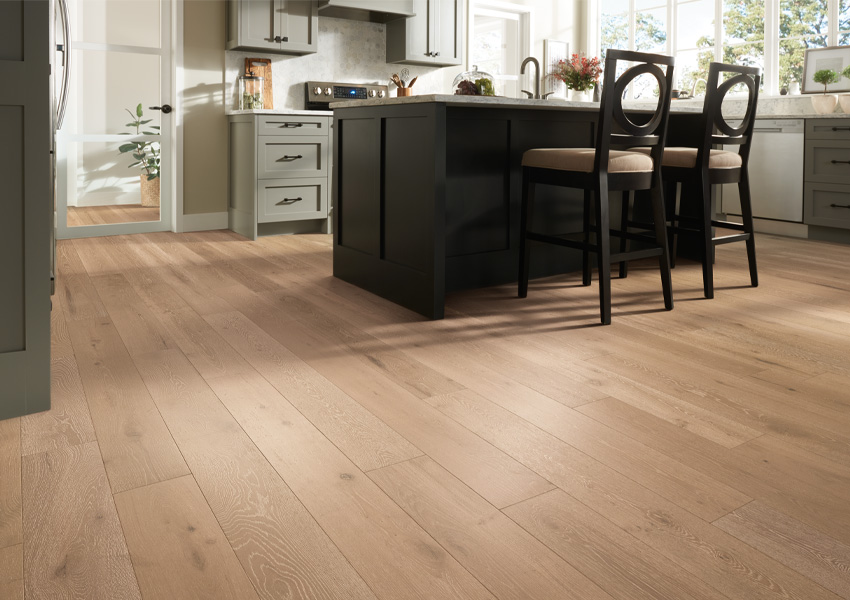 warm toned hardwood flooring in kitchen.